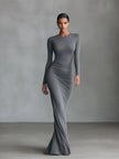 Grey knit ruched maxi dress by FJØRNA, elegant evening dress with a fitted silhouette and ruching detail, suitable for formal occasions.