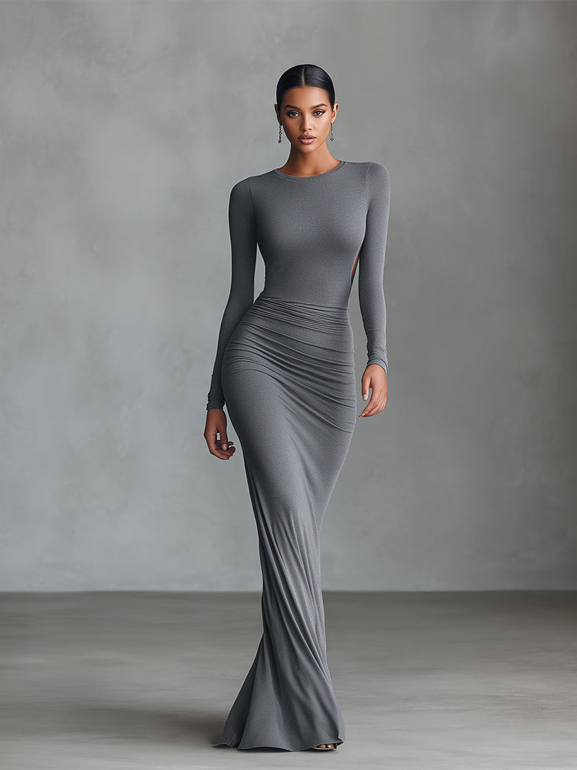 Grey knit ruched maxi dress by FJØRNA, elegant evening dress with a fitted silhouette and ruching detail, suitable for formal occasions.