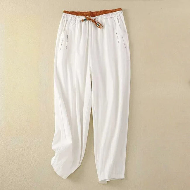 FJØRNA women's lightweight summer trousers, ankle length, breathable fabric for comfortable warm-weather wear.