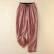 Lightweight women's summer trousers by FJØRNA, ankle-length and breathable, shown in a relaxed fit on a model.