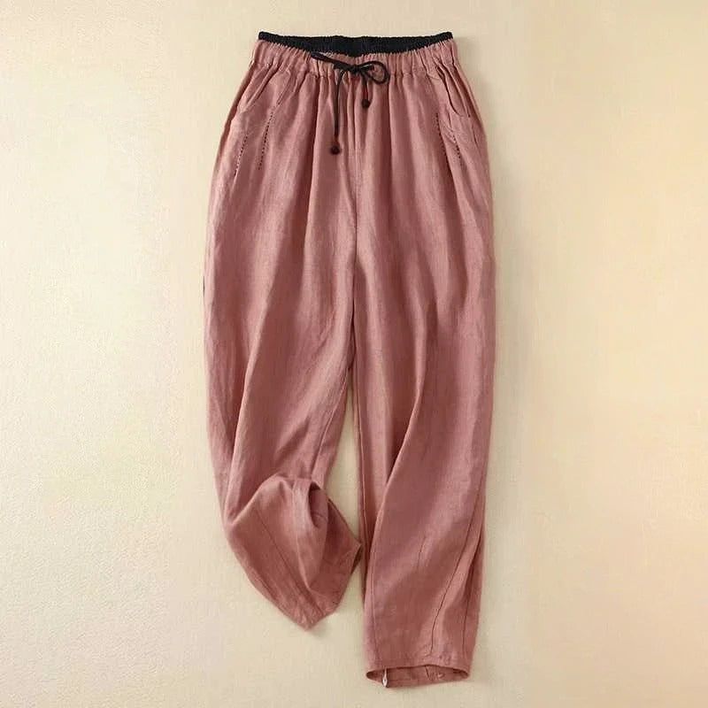 Lightweight women's summer trousers by FJØRNA, ankle-length and breathable, shown in a relaxed fit on a model.