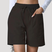 FJØRNA women's lightweight summer shorts with wide legs, drawstring waist, and side pockets, ideal for casual warm-weather wear.