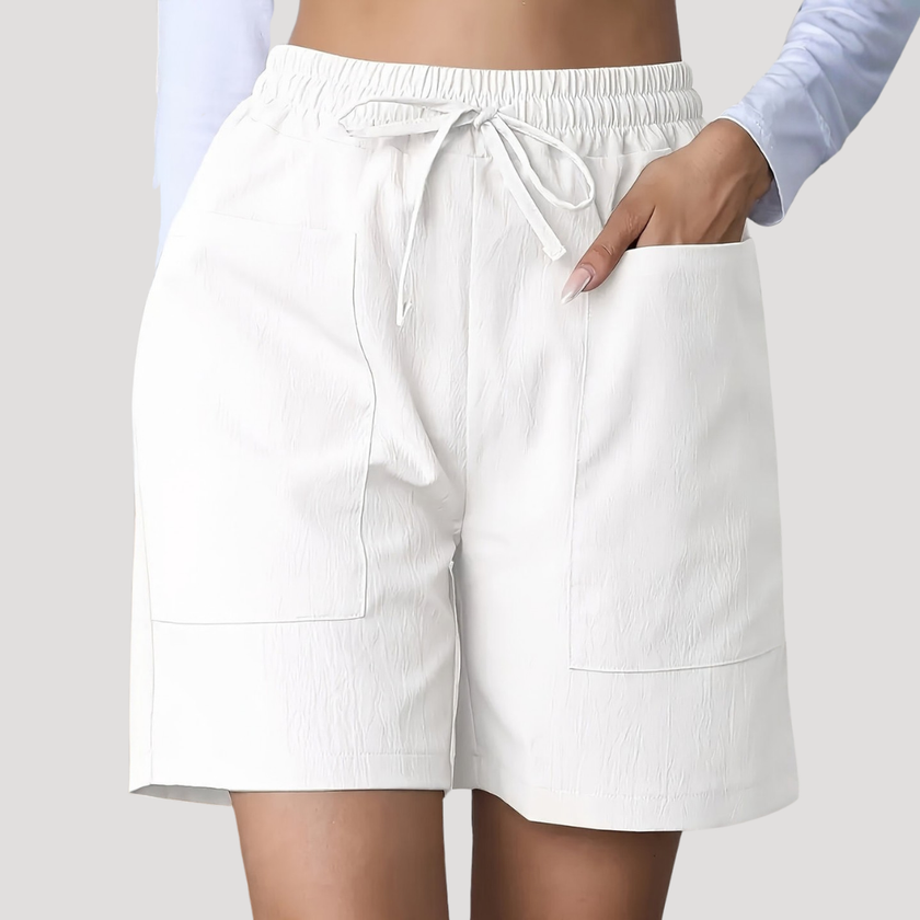 FJØRNA women's lightweight summer shorts with wide legs, drawstring waist, and pockets, perfect for casual warm-weather wear.