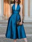 FJØRNA halter V-neck pleated midi dress, elegant wedding guest dress in soft fabric, featuring a flattering V-neck and pleated skirt.