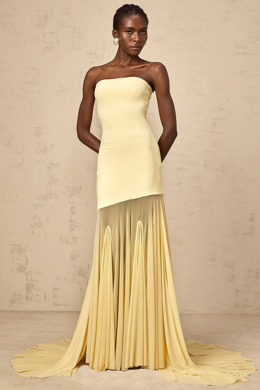 FJØRNA yellow off-shoulder sheer tulle maxi dress with black tie detail for women, elegant evening dress with flowing silhouette.