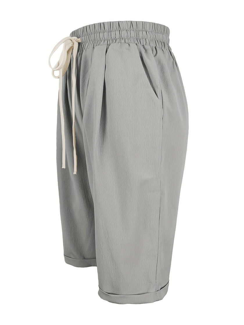 FJØRNA lightweight summer Capri pants for women with a drawstring elastic waist, shown in a relaxed fit and casual style.