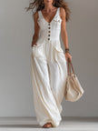 White sleeveless wide-leg jumpsuit with patch pockets for women, stylish FJØRNA pants featuring a relaxed fit and modern design.