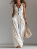 White sleeveless wide-leg jumpsuit with patch pockets for women, stylish FJØRNA pants featuring a relaxed fit and modern design.