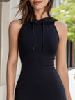 FJØRNA sleeveless hooded bodycon mini dress with contrast hem, shown on a mannequin, highlighting its fitted silhouette and stylish design.