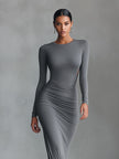 FJØRNA grey knit ruched maxi dress, elegant evening dress with a fitted bodice and flowing skirt, perfect for formal occasions.