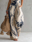 White ink wash print halter neck wide-leg jumpsuit for women with pockets, by FJØRNA, featuring a stylish and comfortable design.