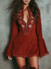 Red lace embroidered mini dress by FJØRNA, featuring intricate embroidery and a fitted silhouette for evening wear.