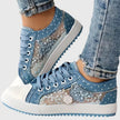FJØRNA women's orthopedic sneakers with breathable mesh and cushioned insoles, designed for comfort and support.