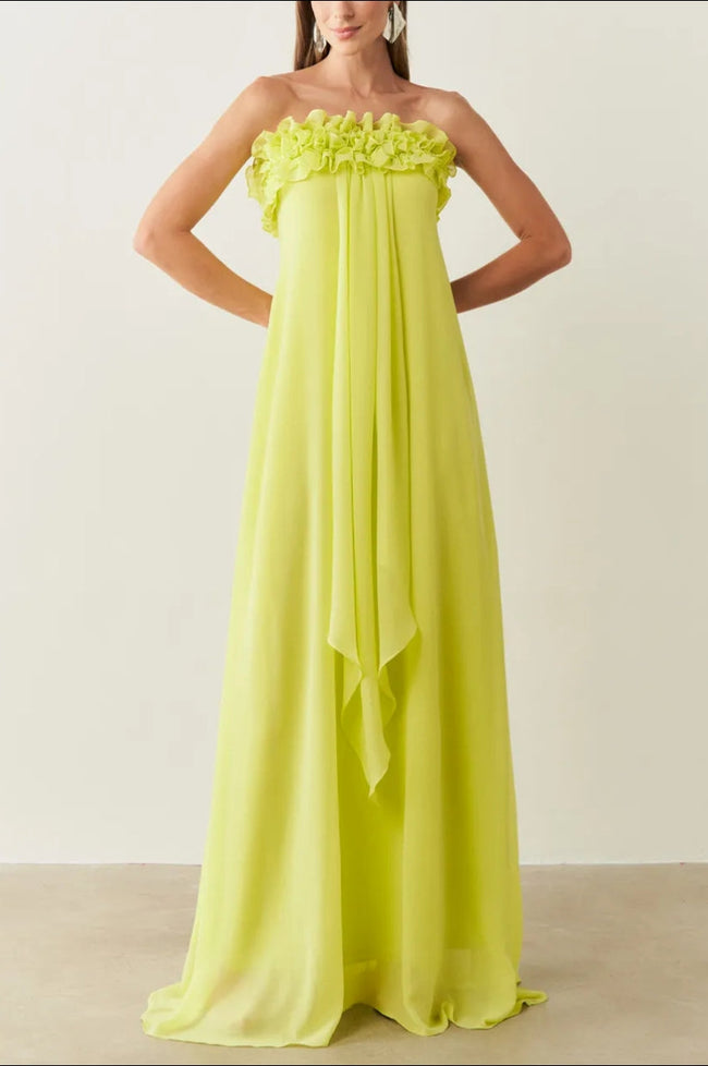 Green chiffon sleeveless maxi dress with frill details by FJØRNA, shown on a model in a flowing, elegant design.