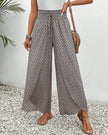 Beige FJØRNA women's lightweight summer trousers with wide leg fit and breathable fabric, perfect for warm weather.