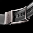 Gray vegan leather ratchet belt by FJØRNA, adjustable unisex belt with a modern buckle design.