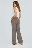 Lightweight high-waist wide-leg summer trousers for women by FJØRNA, with pockets and breathable fabric, styled on a model.