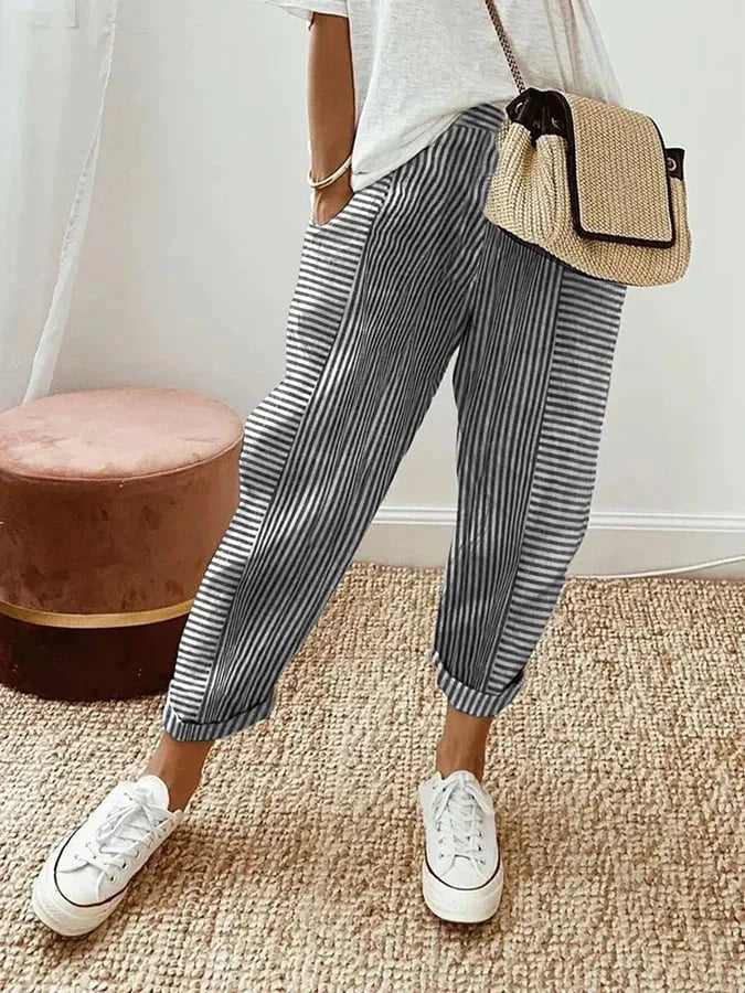 Black FJØRNA women's lightweight summer trousers with straight legs and drawstring waist, perfect for casual warm-weather wear.