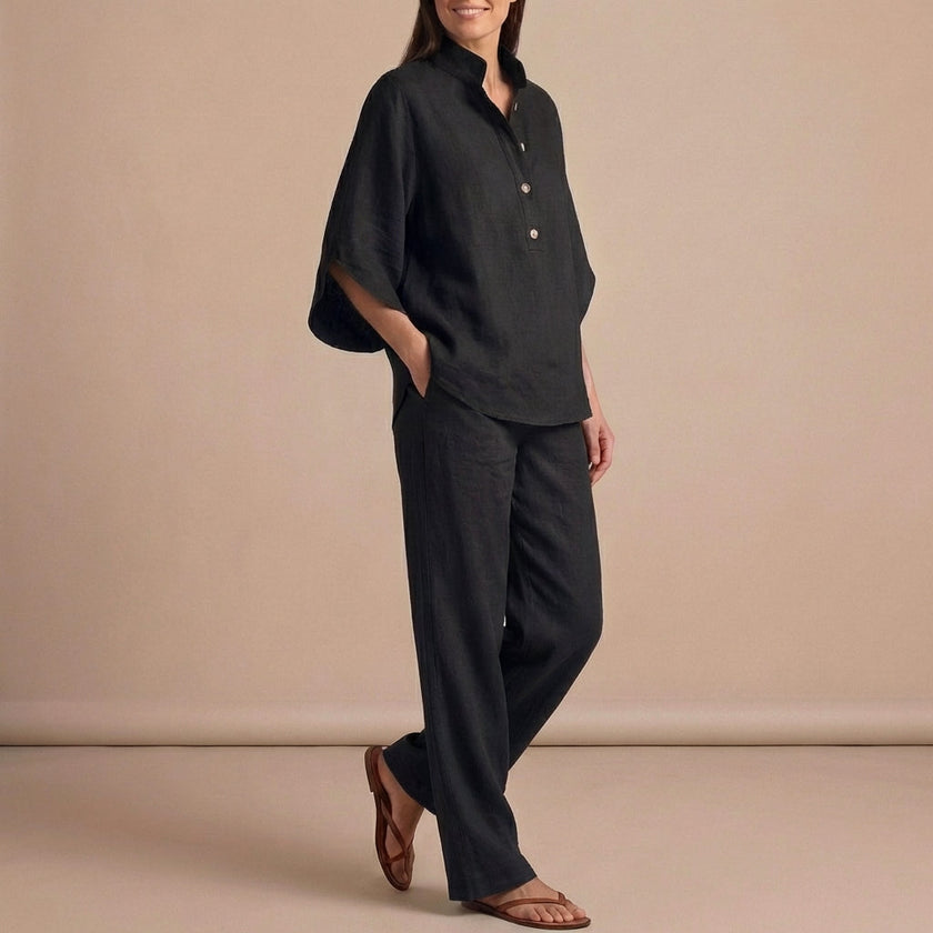 Black FJØRNA women's two-piece co-ord set with button-front top and matching pants, stylish and elegant for versatile wear.