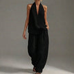 Black FJØRNA women's two-piece co-ord set with V-neck top and matching pants, featuring side pockets for a stylish summer look.