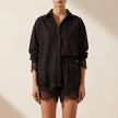 Black lace two-piece co-ord set for women by FJØRNA, featuring a stylish lace top and matching high-waisted pants.