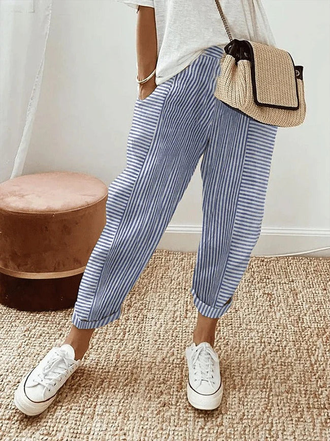 Blue lightweight summer women's trousers with straight leg fit and drawstring waistband by FJØRNA.