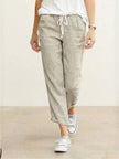 FJØRNA women's linen summer trousers with straight leg fit and drawstring waist, breezy and relaxed for warm weather.