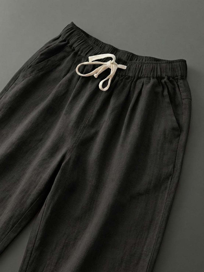 FJØRNA linen summer trousers for women with a breezy, relaxed fit and straight leg design, featuring a drawstring waist.