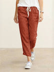 FJØRNA women's linen summer trousers with a breezy, relaxed fit and straight-leg style featuring a drawstring waist.