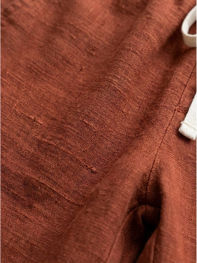 FJØRNA women's linen summer trousers with a breezy relaxed fit and straight leg design, featuring a drawstring waistband.