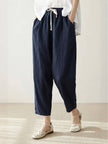 FJØRNA linen summer trousers for women with a breezy, relaxed fit and straight leg design, featuring a drawstring waist.