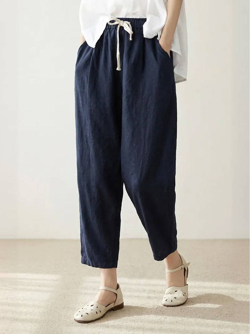 FJØRNA linen summer trousers for women with a breezy, relaxed fit and straight leg design, featuring a drawstring waist.