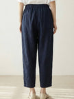 FJØRNA women's linen summer trousers with a breezy, relaxed fit and straight-leg design featuring a drawstring waist.