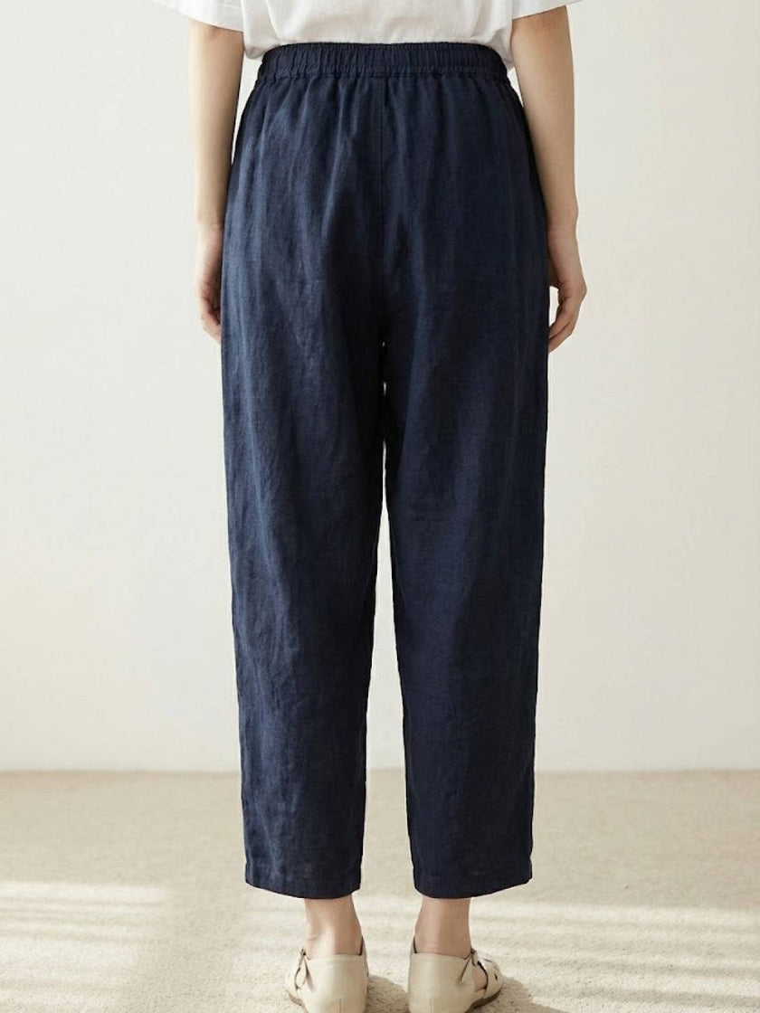 FJØRNA women's linen summer trousers with a breezy, relaxed fit and straight-leg design featuring a drawstring waist.