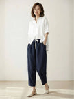 FJØRNA women's linen summer trousers with a breezy, relaxed fit and straight leg style, featuring a drawstring waist.
