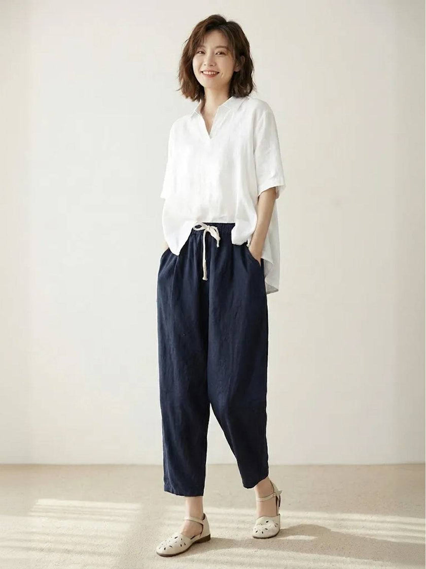 FJØRNA women's linen summer trousers with a breezy, relaxed fit and straight leg style, featuring a drawstring waist.