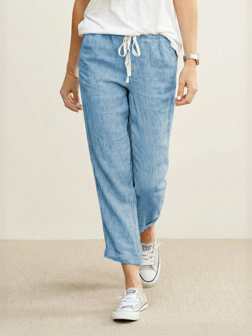 FJØRNA women's linen summer trousers with a breezy relaxed fit and straight-leg style, featuring a drawstring waist.