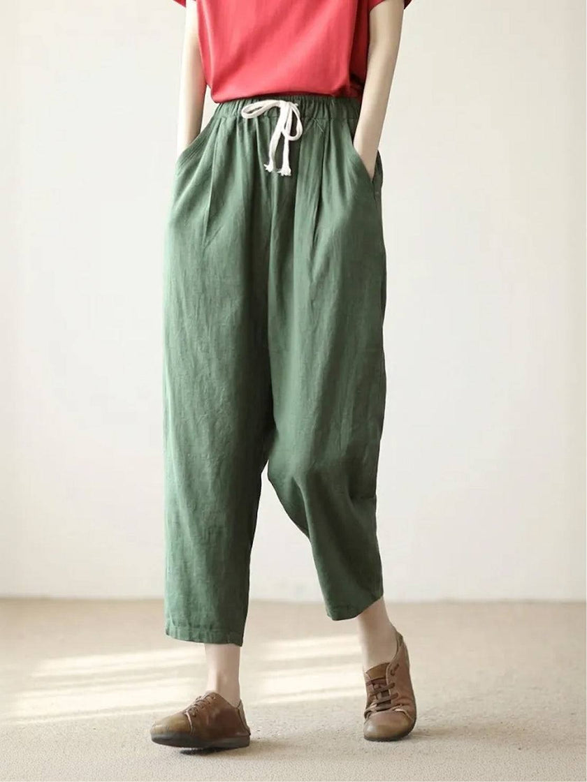 FJØRNA linen summer trousers for women with a relaxed fit and straight-leg style, featuring a drawstring waist and breathable fabric.