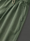 FJØRNA women's linen summer trousers with a breezy, relaxed fit and straight leg design, featuring a drawstring waist.