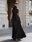 FJØRNA black one-shoulder draped high-neck maxi dress, elegant evening dress with flowing fabric and sophisticated design.