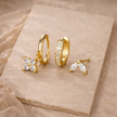 Unisex minimalist piercing set with stainless steel hoops and studs, featuring simple, elegant jewelry accessories for women.