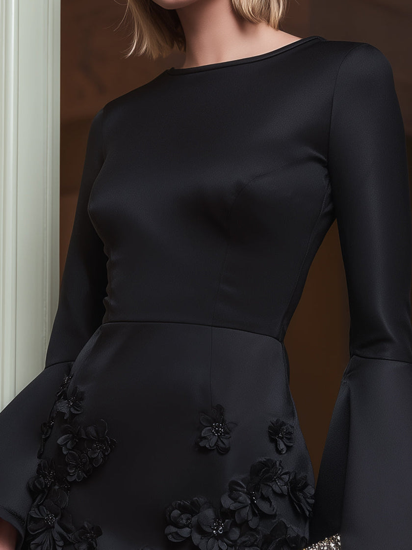 FJØRNA black floral appliqué long-sleeve mini cocktail dress with intricate floral details and elegant silhouette.