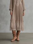 FJØRNA Whispered Snow Knit Maxi Dress, a cozy elegant occasion dress with intricate knit details and a flowing silhouette.
