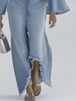 Light blue denim flared long sleeve jumpsuit with wide-leg pants for women, by FJØRNA, displayed on a model.