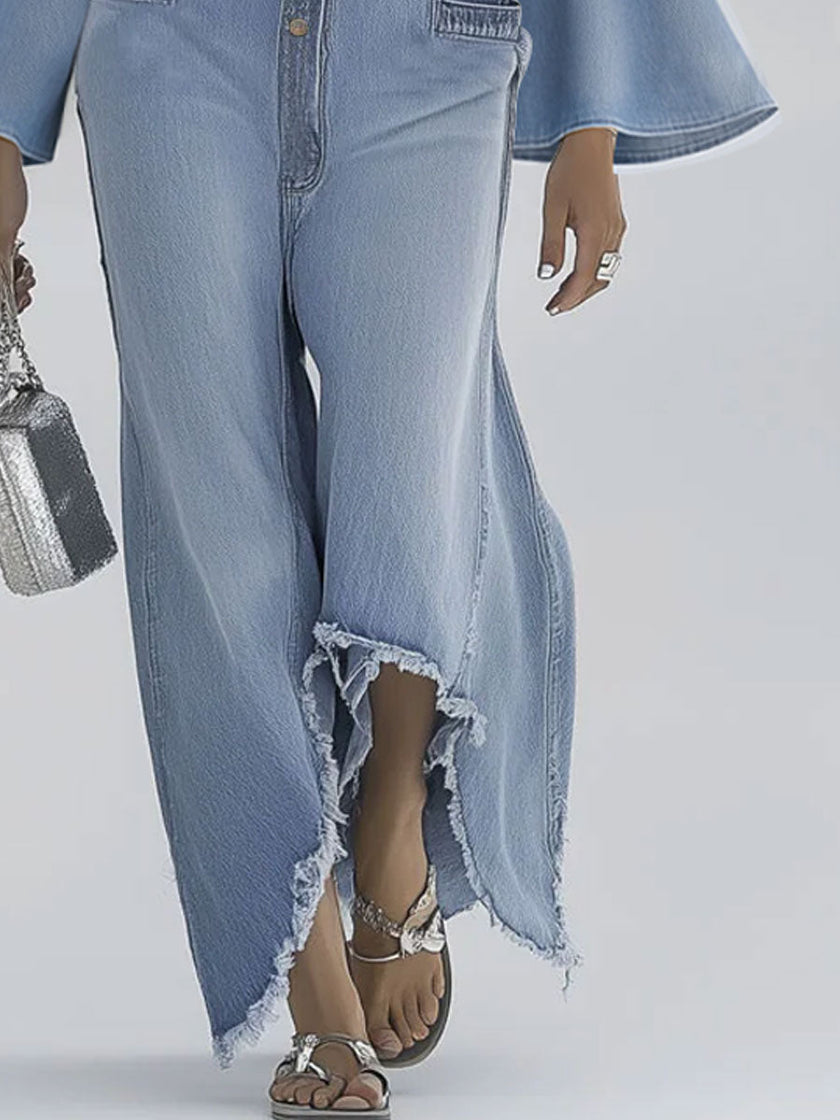 Light blue denim flared long sleeve jumpsuit with wide-leg pants for women, by FJØRNA, displayed on a model.
