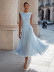 FJØRNA draped neck sleeveless pleated midi dress, elegant wedding guest dress with flowing fabric and midi length.
