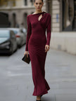 FJØRNA burgundy long-sleeve draped cutout evening gown with elegant design, suitable for black-tie events.