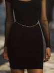 FJØRNA black mesh-panel cutout bodycon dress, stylish cocktail dress with fitted silhouette and modern design, shown on a model.