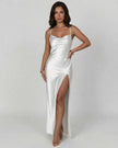 Celadon green satin V-neck maxi dress with high slit, elegant asymmetrical design by FJØRNA, perfect for formal occasions.