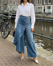 FJØRNA women's lightweight summer trousers with high waist, wide leg, button front, and breathable fabric.